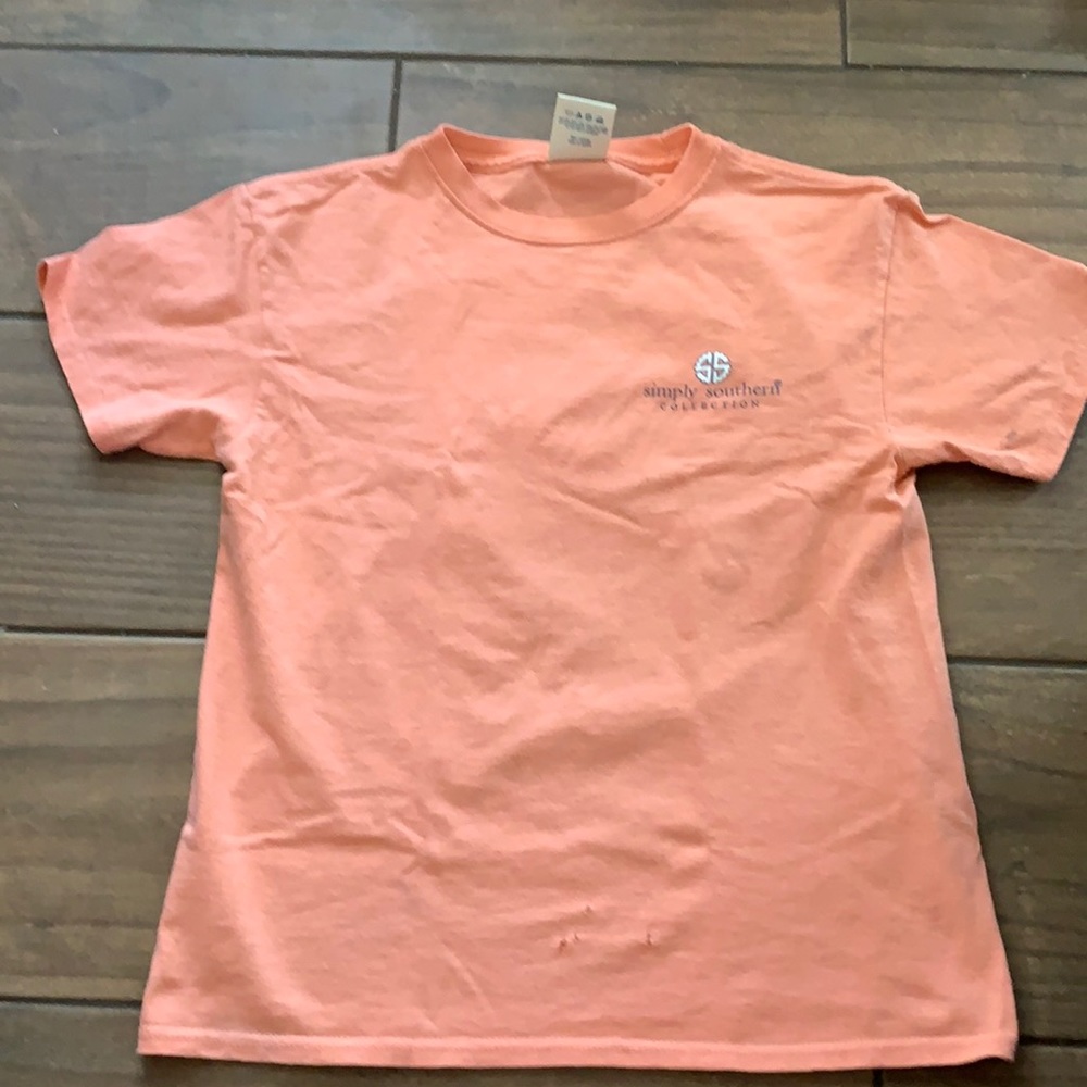 This doesn’t fit anymore! Size youth medium.